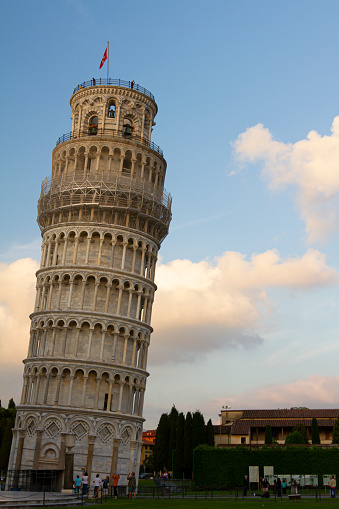 Iconic leaning tower of Pisa at sunset. This image of the very famous tower was taken during the construction work in 2010 which with the use of visible suspension straightened the posture.