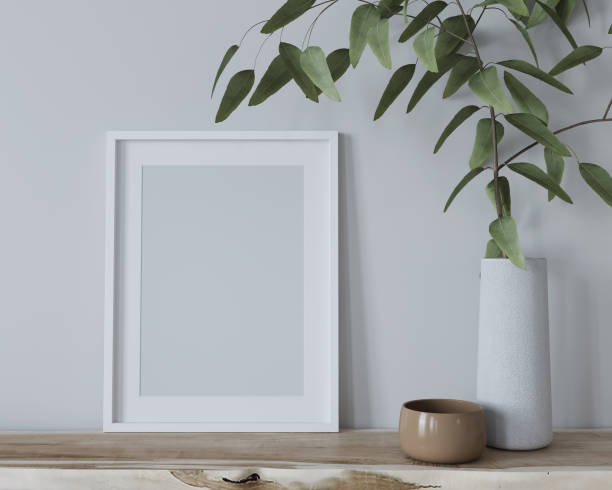 istock Mock up interior with a frame for a poster and a vase with a branch 1283064298