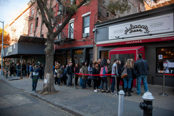 Long lines form in front of highly popular Juliana's Pizza of Brooklyn stock photo