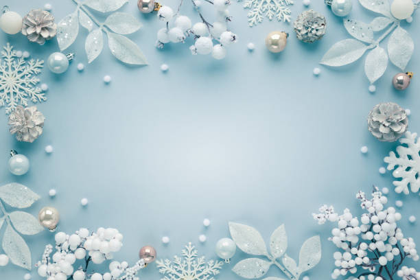 istock Christmas frame with festive decorations, snowflakes, baubles on pastel background 1283065658