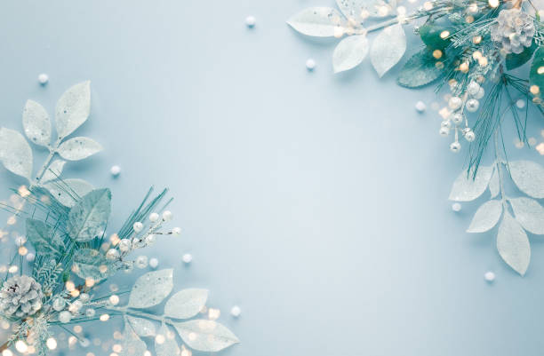 istock Christmas arrangement with silver leaves on pastel background. 1283065672