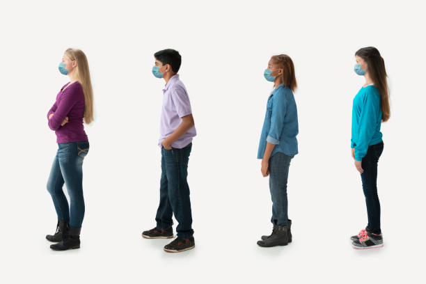 istock Group of student wearing protecting mask covid 19 1283066618