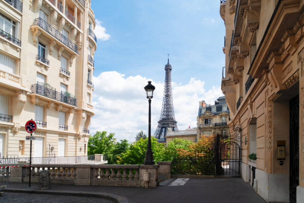 istock eiffel tour and Paris street 1283067392