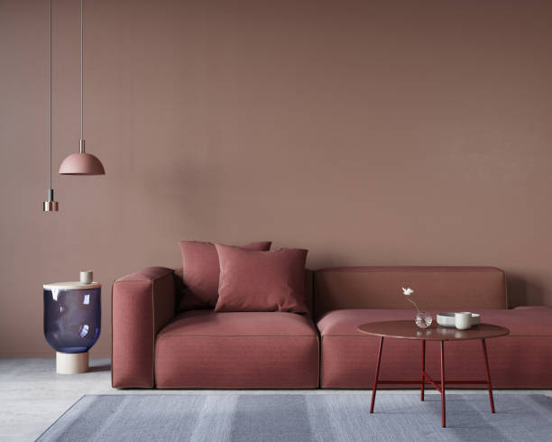 интерьер гостиной с большим красным диваном - furniture contemporary domestic room sparse стоковые фото и изображения