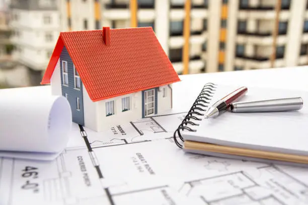 House model with blueprint sample and pen stock photo