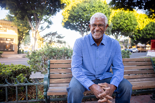 Senior Black business owner wearing apron