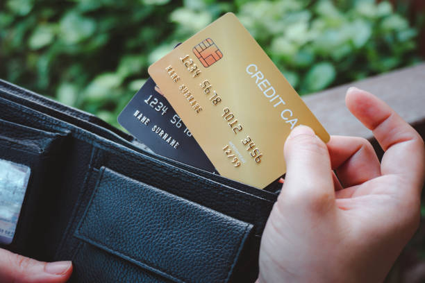 istock Woman hand open wallet showing credit card 1283070747