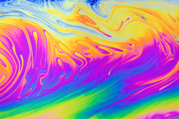 istock Psychedelic multicolored patterns background. Photo macro shot of soap bubbles 1283070816
