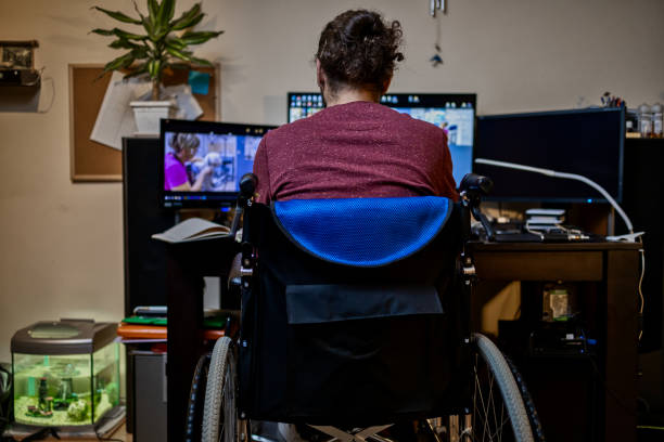 istock Man in wheelchair at home 1283071929