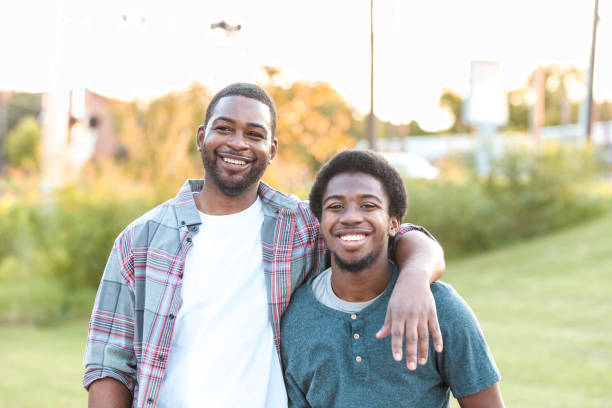 istock Dad and son relax together at park on weekend 1283072025