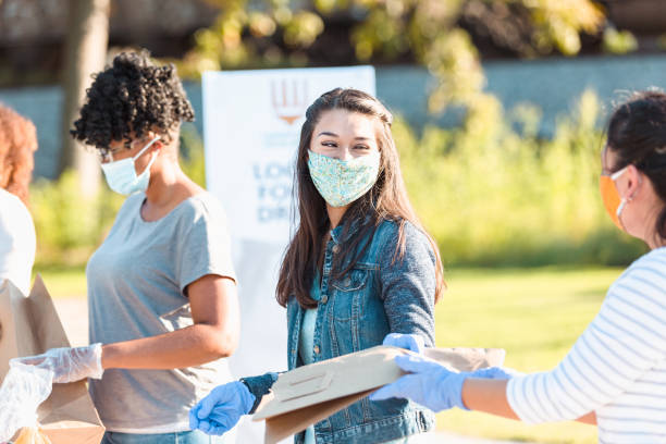 istock Diverse women work at the local food drive 1283072045