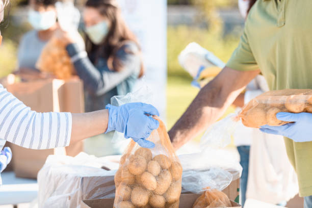 istock Unrecognizable couple volunteer during food drive 1283072085