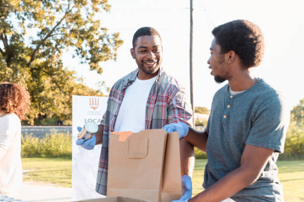 istock Father and son volunteer during charity drive 1283072091