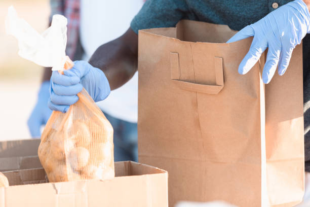 istock Volunteer prepares food donations 1283072097