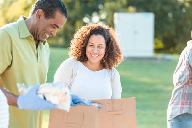 istock Couple volunteering during food drive 1283072128