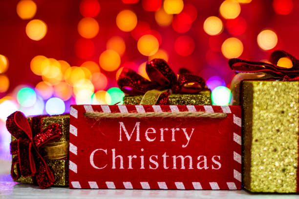 istock Decorations and ornaments in a colorful Christmas composition isolated on background of blurred lights. 1283072941