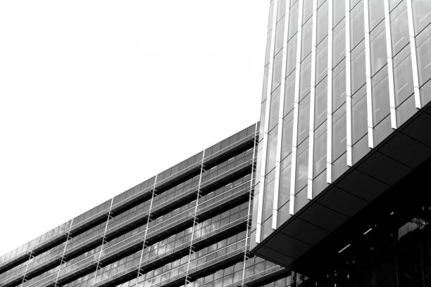 istock Black and white modern office building, white background with copy space 1283075306