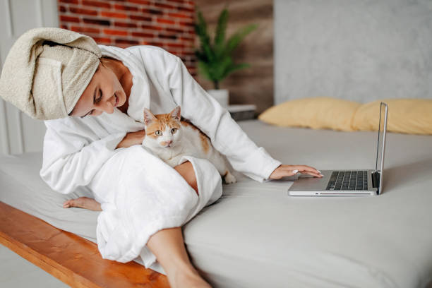 istock Woman on bed near laptop 1283075505