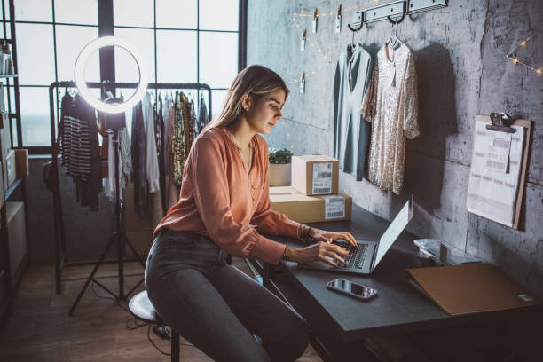 istock Young woman running online store 1283076351