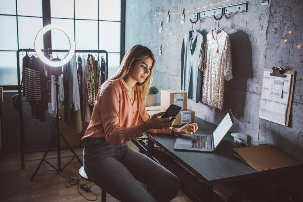 istock Young woman running online store 1283076392