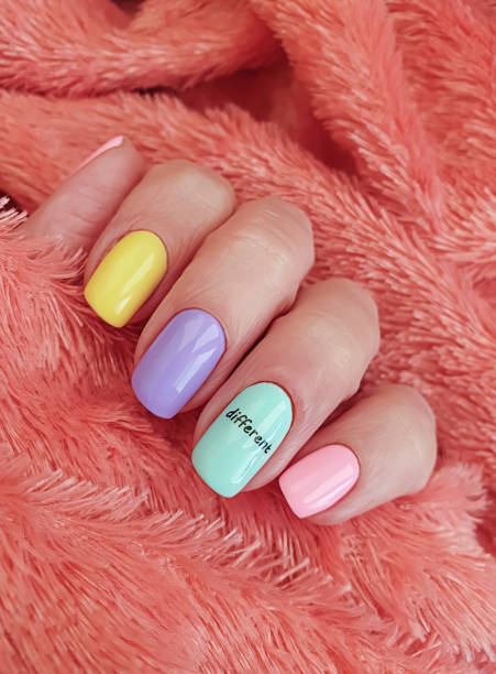 istock female hand beautiful colored manicure 1283077679