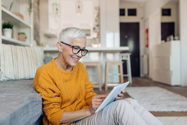 istock Mature businesswoman working online on tablet 1283079561
