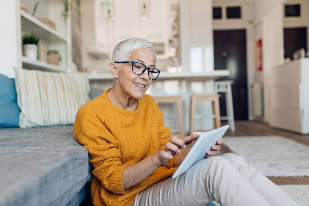 istock Senior businesswoman working on the web from home 1283079567