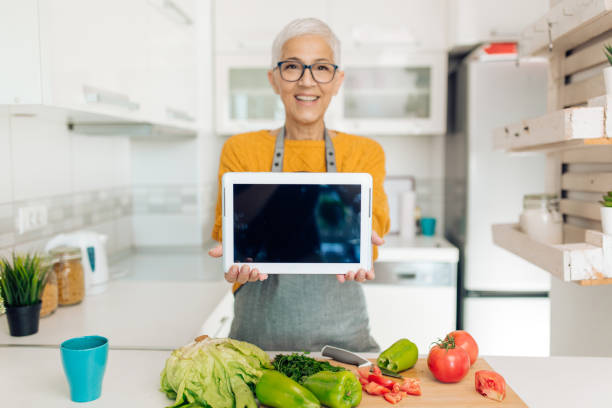 istock Portrait of a mature vegetarian making tutorial about preparing vegetables 1283079657