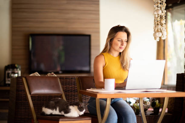 istock Woman using laptop and working at home 1283081351