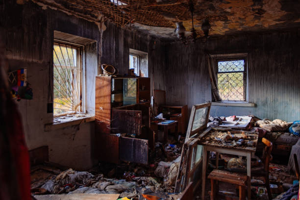 istock Burnt old rural house interior. Consequences of fire 1283081436