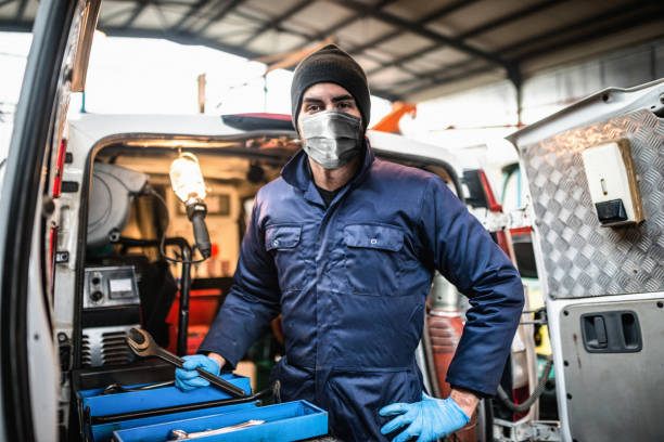 istock mechanic in front of the van with face mask 1283081756