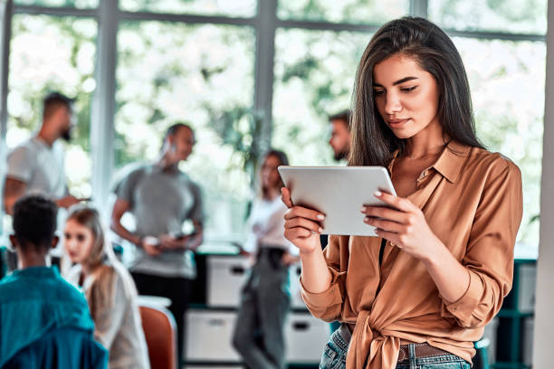 istock Businesswoman using digital tablet in the office 1283084410