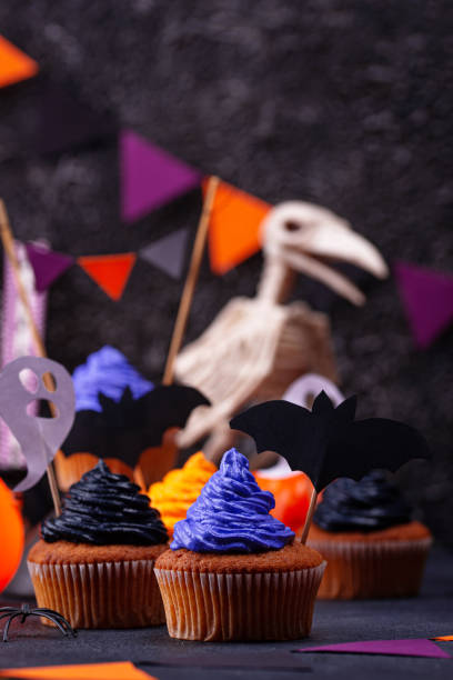 istock Halloween cupcakes with color cream 1283087119
