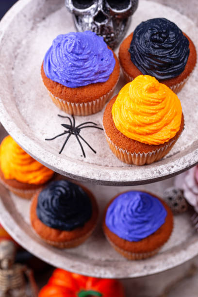 istock Halloween cupcakes with color cream 1283087126