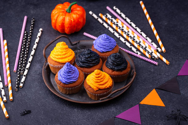 istock Halloween cupcakes with color cream 1283087130