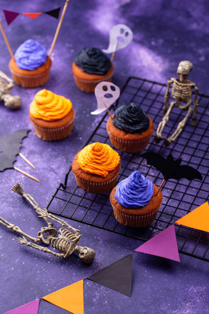 istock Halloween cupcakes with color cream 1283087133