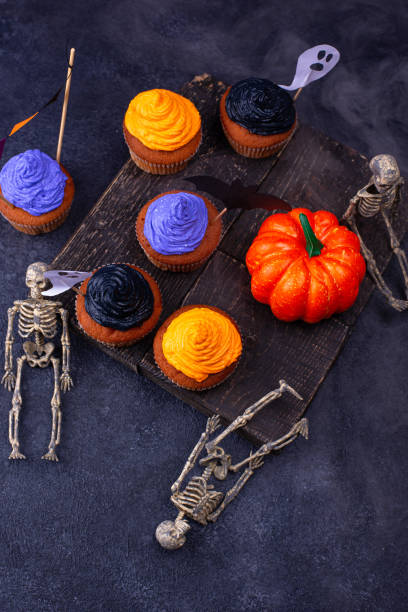 istock Halloween cupcakes with color cream 1283087146