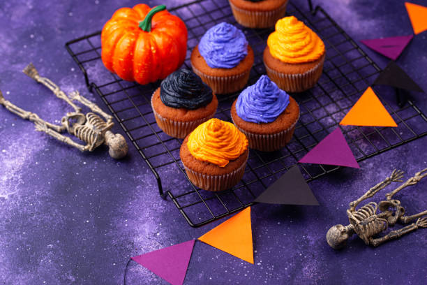istock Halloween cupcakes with color cream 1283087154