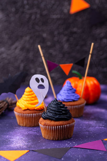 istock Halloween cupcakes with color cream 1283087158