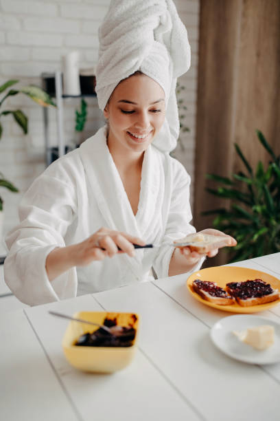 istock Beautiful woman has breakfast at home 1283087523