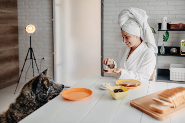 istock Beautiful woman has breakfast at home 1283087572