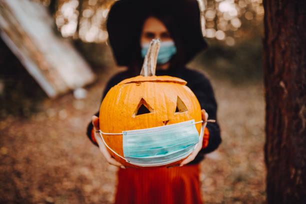 istock Celebration of Halloween with protective masks 1283089437