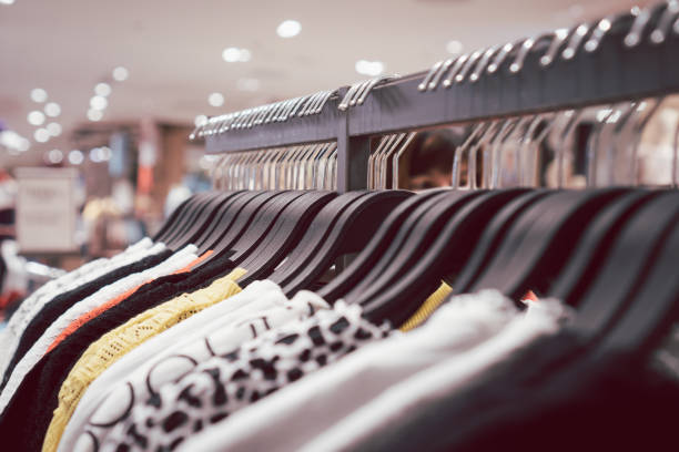 istock Close up clothes hangers on rack. 1283089460