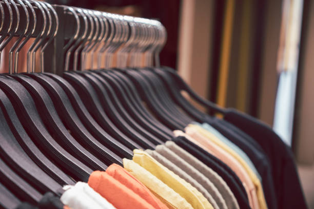 istock Close up clothes hangers on rack. 1283089499