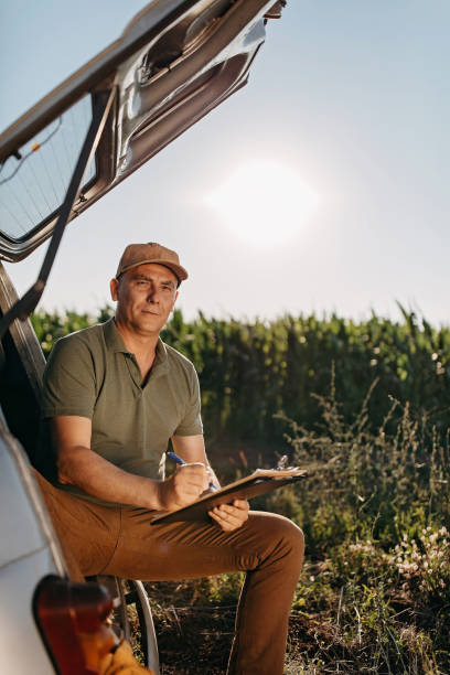 istock Mid adult farmer inspects his land 1283090486