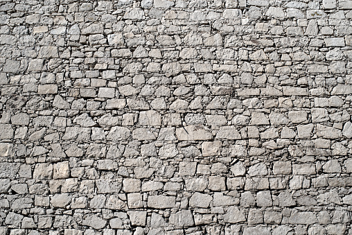 Grungy old brick stone wall texture background