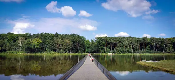A bike path that sinks into the water to cross a lake