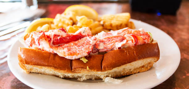 istock Fresh MAine lobster roll on plate with waffle fries 1283094330