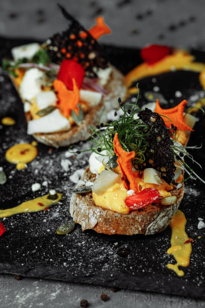 istock bruschettas with pumpkin mousse and goat cheese. Light breakfast, snack. halloween 1283094366