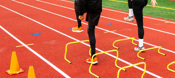 istock Two runners performing sports drills on a track 1283094377